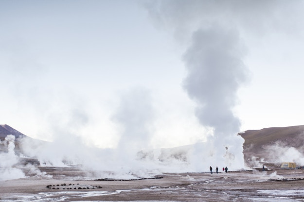 A group exploring the geysers at El Tatio © Joao Inacio / Moment Open / Getty