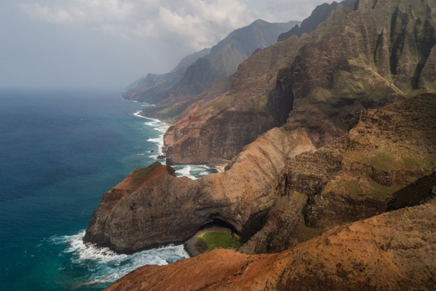 Natural arch on the south side of Honopu Beach on Na Pali Coast of Kauai.