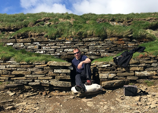 About to slide into the depths of a Stone Age tomb... on a small trolley on wheels © James Kay