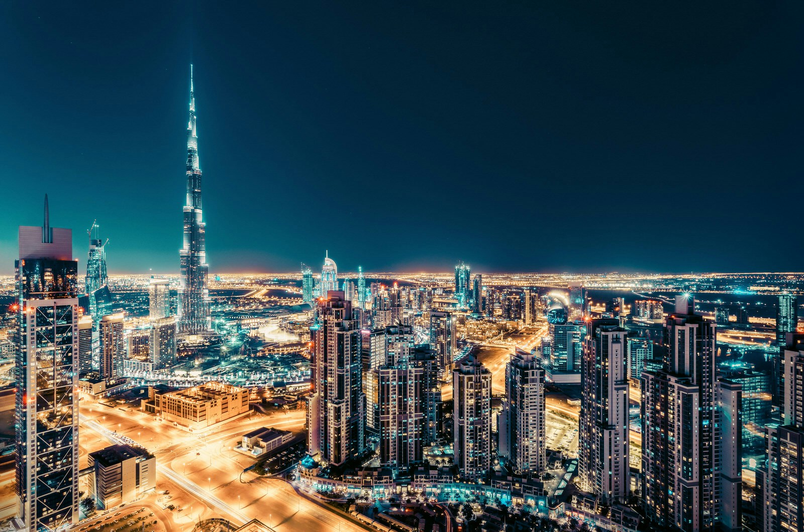 Elevated view of downtown Dubai, UAE, at night with illuminated skyscrapers © Funny Solution Studio / Shutterstock