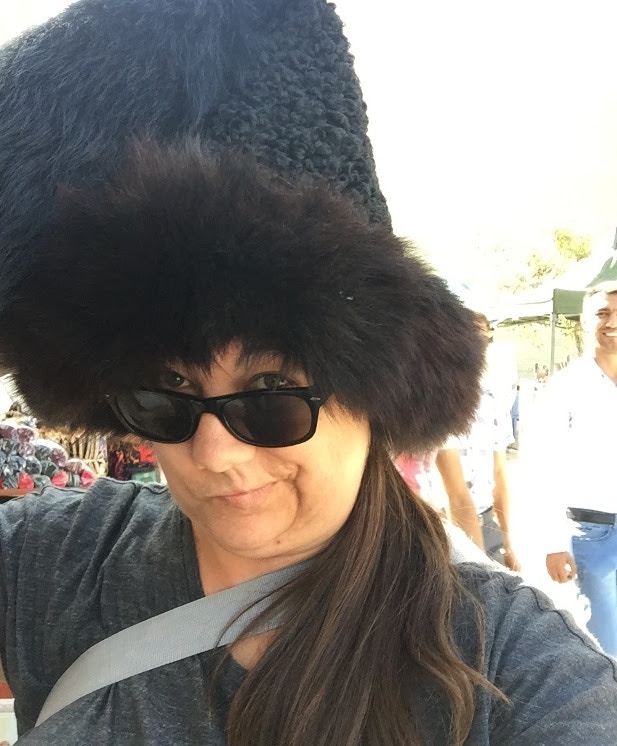 Megan wearing a traditional Turkmen hat