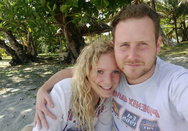 Ellie and her husband snap a selfie on a beach in Madagascar
