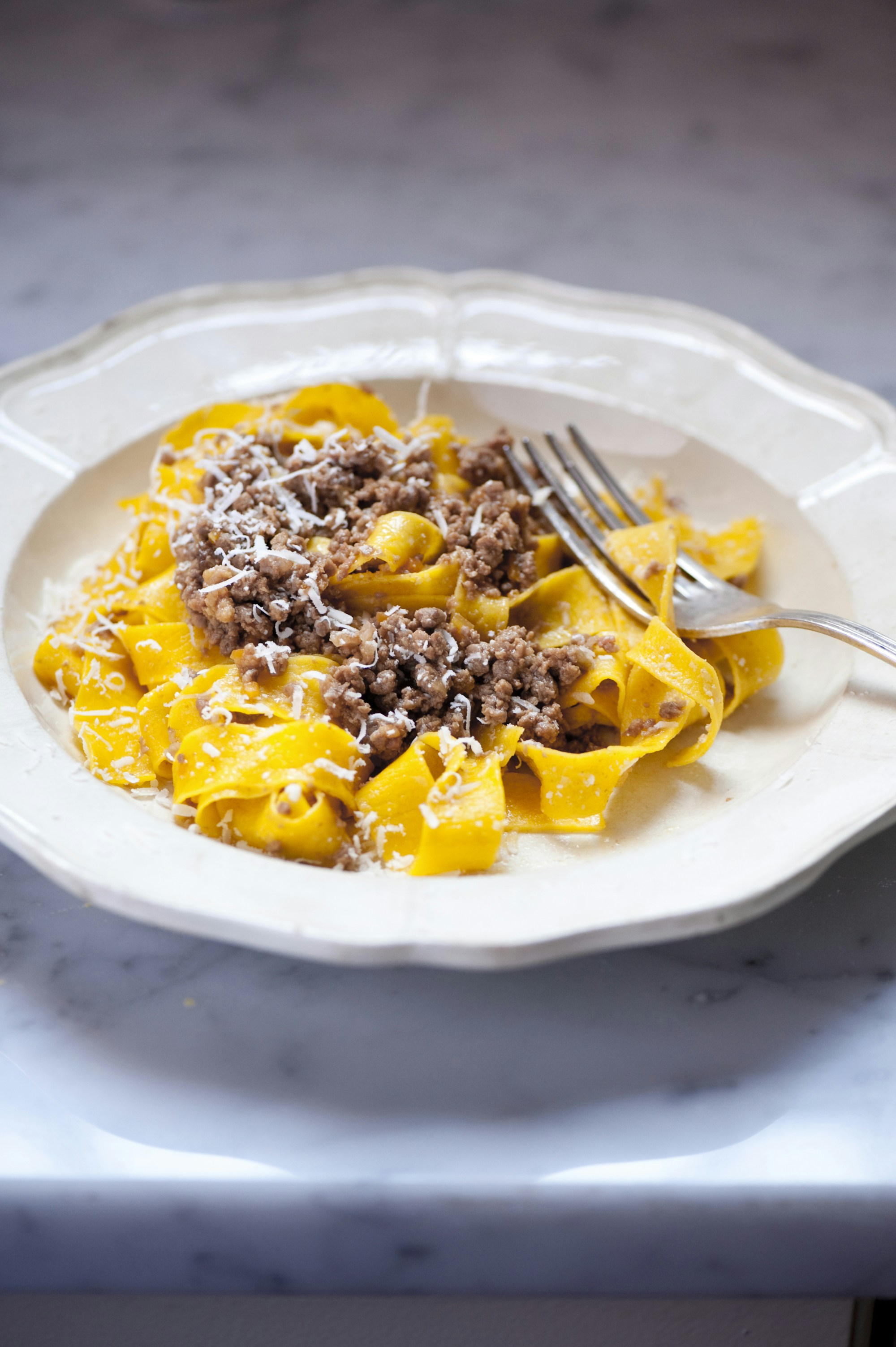 A plate of Bologna’s famous bolognese pasta sauce is always served locally with taglietelle © Susan Wright / Lonely Planet