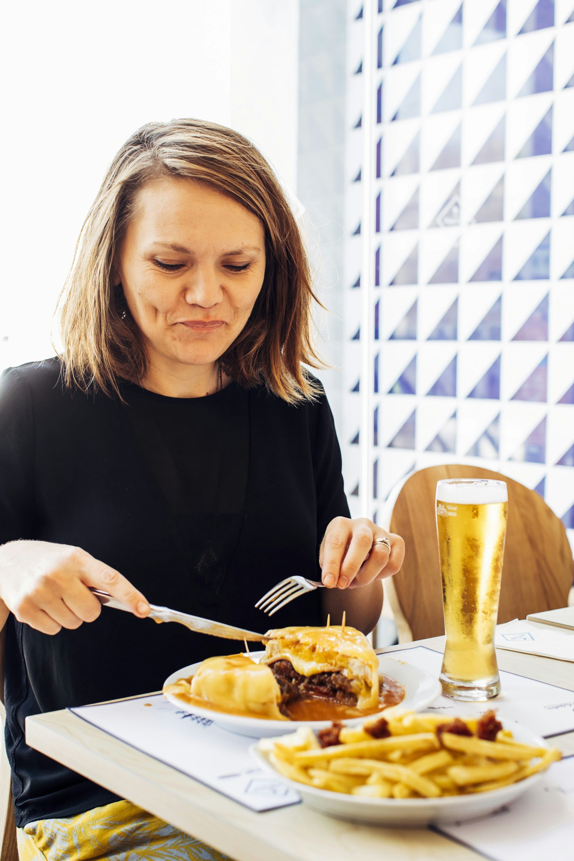 Orla tucking in to a traditional francesinha