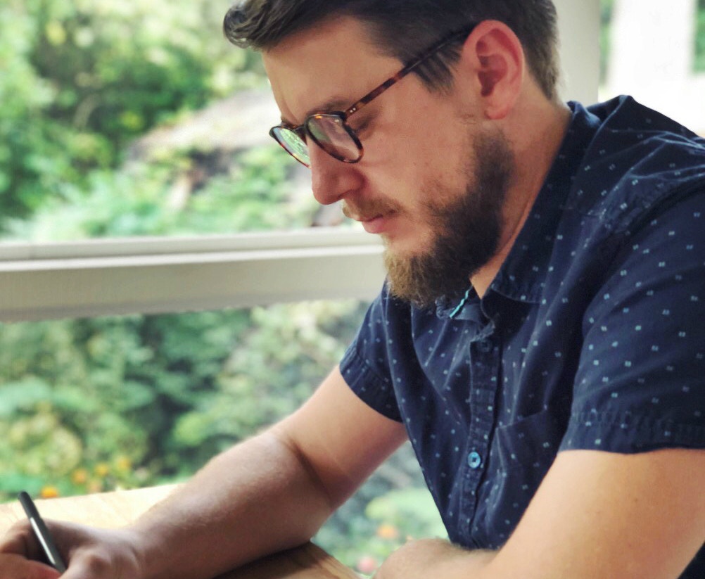 Mike sketching in his studio (or one of three coffee shops)