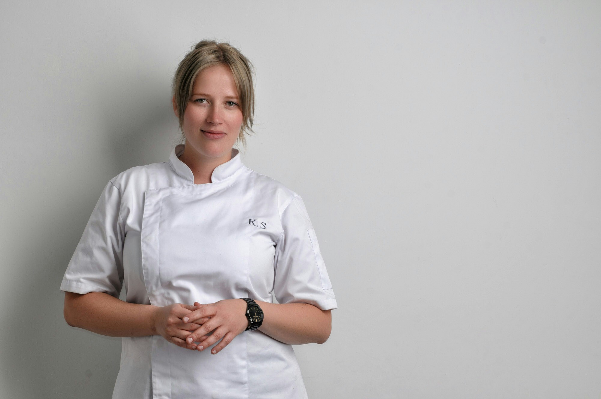A portrait shot of Kamilla Seidler in a white apron