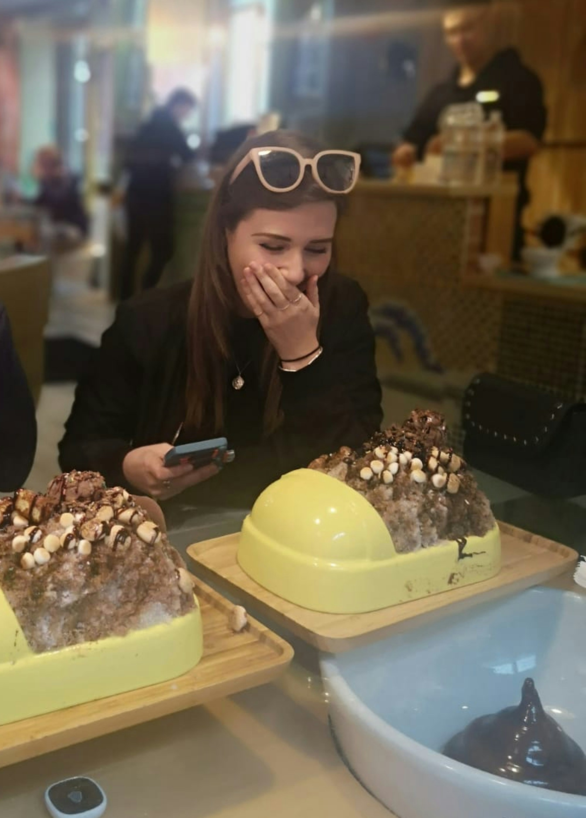 Louise eating at huge portion of chocolate ice cream at the Modern Toilet Cafe
